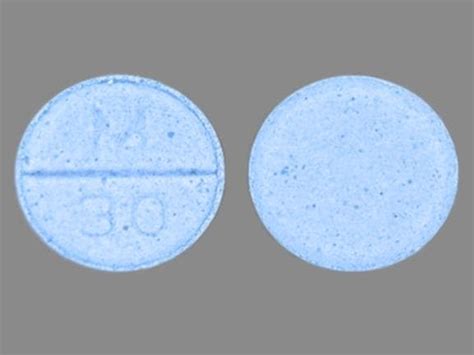 A generic Percocet could be a white, yellow, or blue pill in different shapes. . Blue round pill m on one side 30